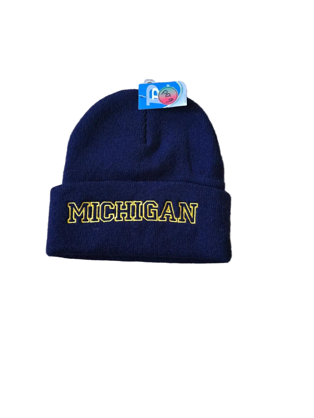 Navy blue beanie with 'Michigan' embroidered on it, on a beige carpet.