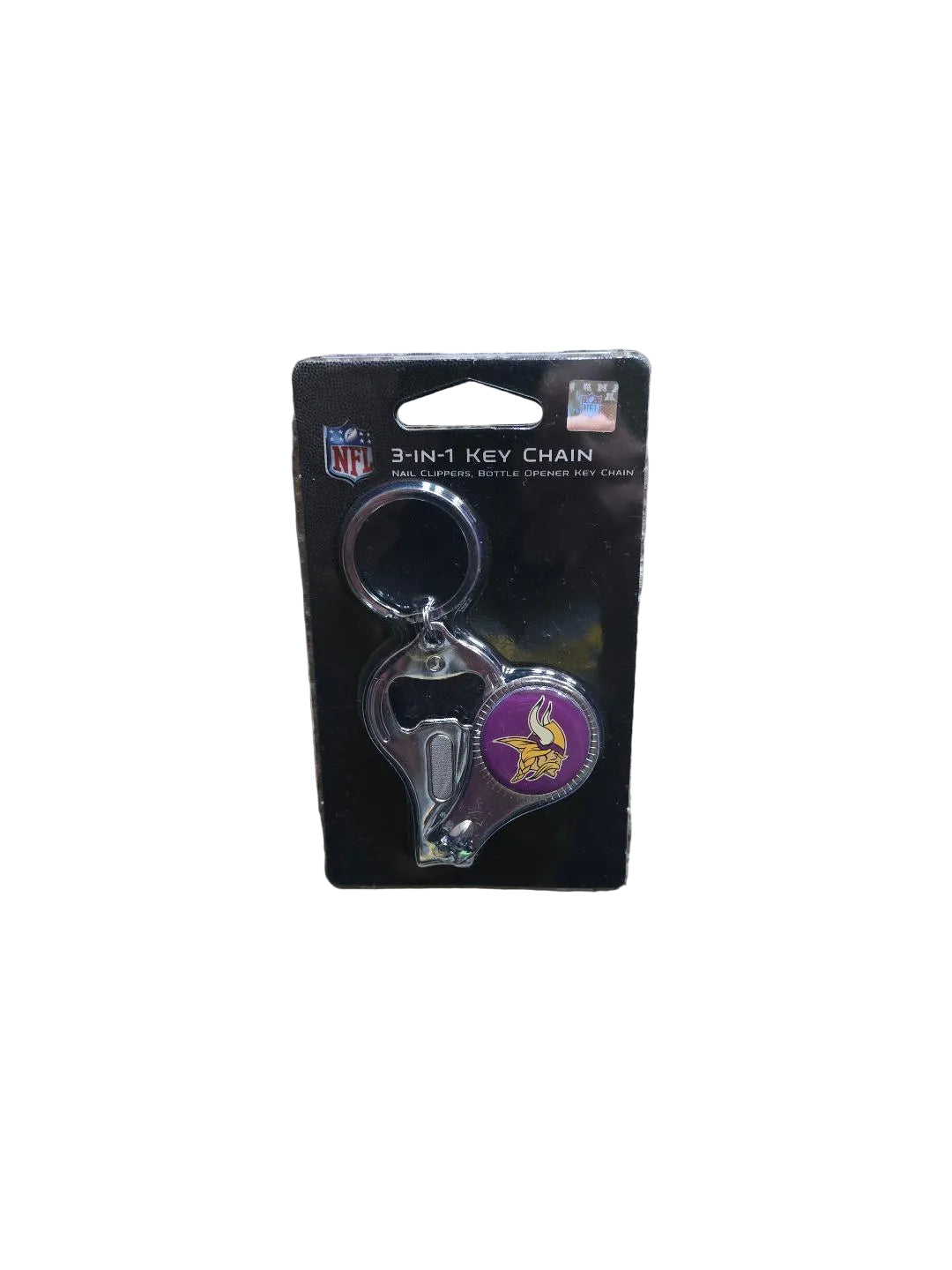 Keychain with bottle opener and cap catcher on a NFL branded card, lying on a carpeted floor.

