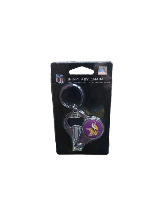 Keychain with bottle opener and cap catcher on a NFL branded card, lying on a carpeted floor.

