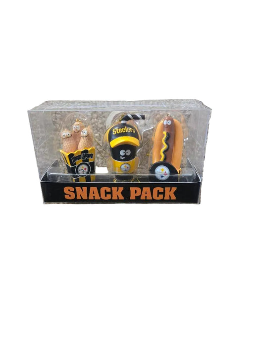 Snack pack with three small items on a beige carpet

