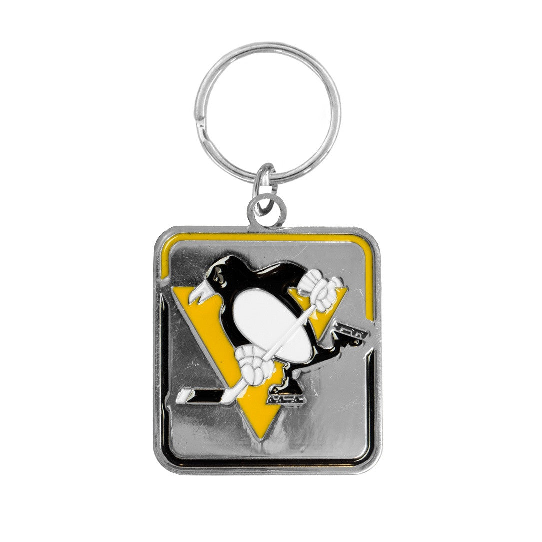 Keychain with a penguin logo on a white background

